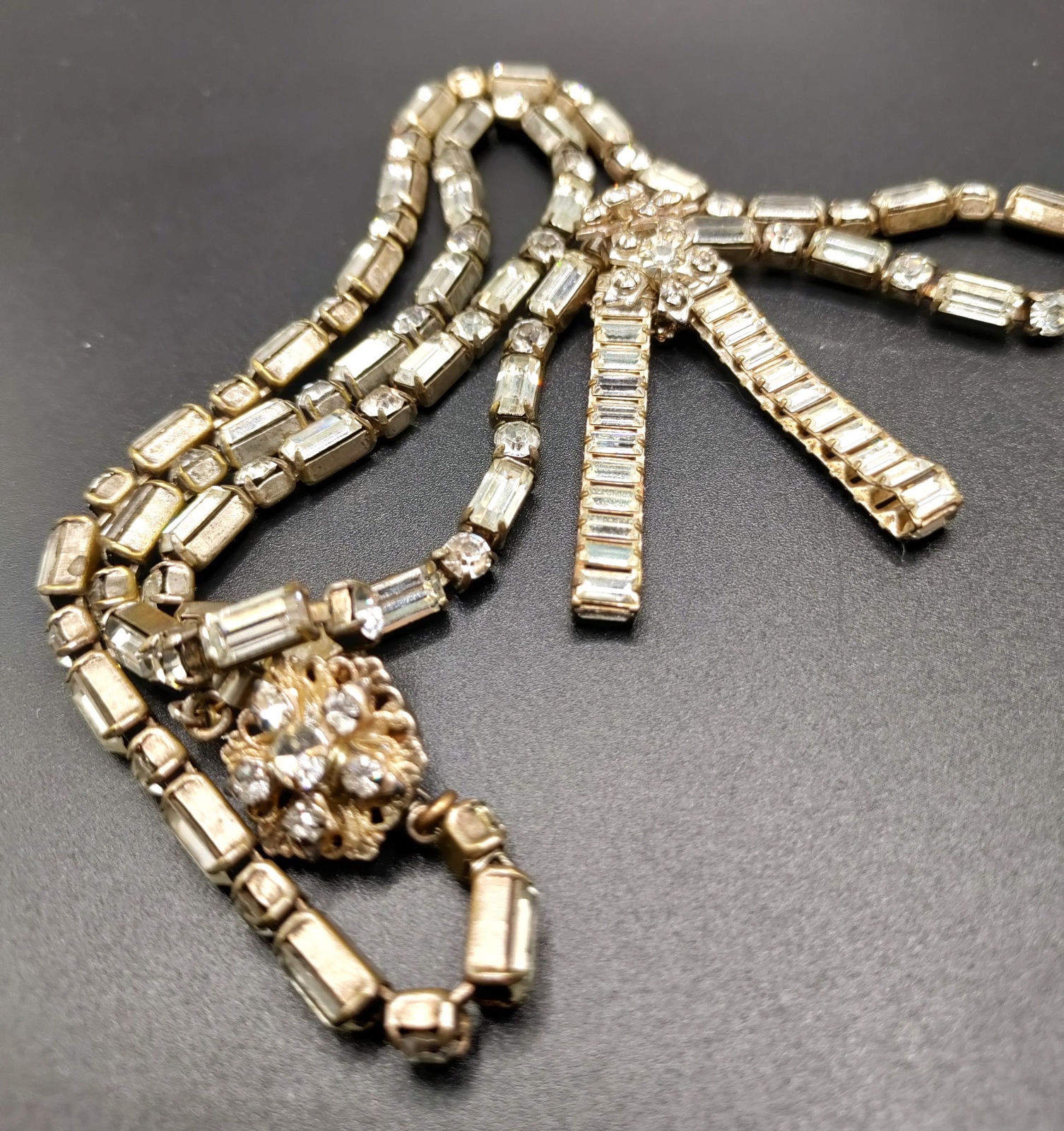 Signed vintage costume jewelry including Trifari and Eisenberg pieces